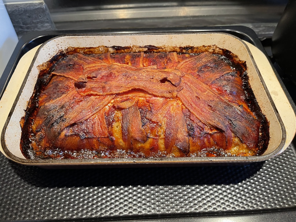 Cooked stuffing cake cooling down in the oven disk