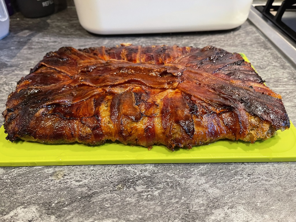 Cooked stuffing cake turned out onto a chopping board ready to serve